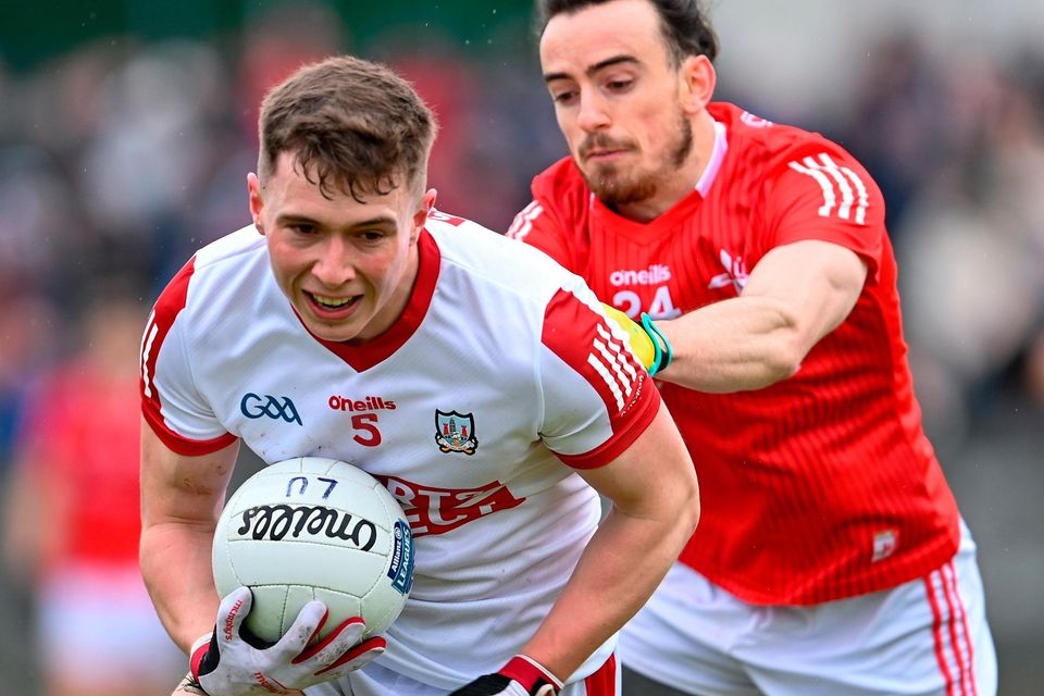 19 March 2023; Luke Fahy of Cork in action against Oisín McGuinness of Louth during the Allianz Football League Division 2 match between Louth and Cork at Páirc Mhuire in Ardee, Louth. Photo by Stephen Marken/Sportsfile