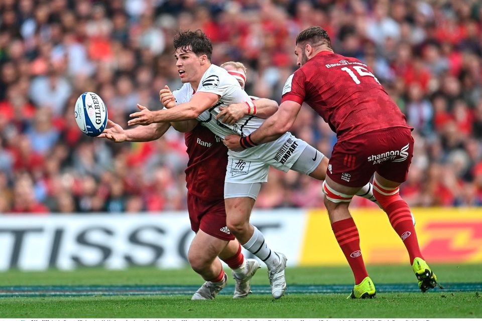 Antoine Dupont of Toulouse is tackled by Jeremy Loughman (left) and Jason Jenkins of Munster during the Champions Cup quarter-final at the Aviva Stadium. Photo: Ramsey Cardy/Sportsfile