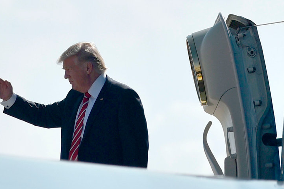 US President Donald Trump salutes before boarding Air Force One on February 6, 2017 in Tampa, Florida. Photo: MANDEL NGAN/AFP/Getty Images