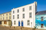 thumbnail: Marine House (blue doors) is on the market with a guide price of €950,000.