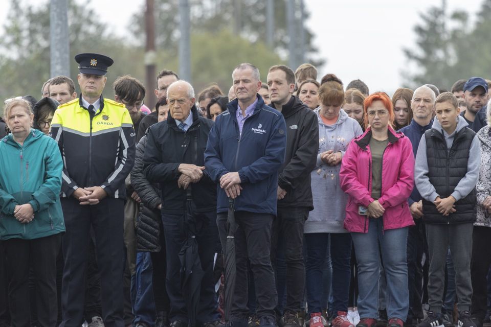 Mourners gather at the site of the Creeslough tragedy one year on. Photo: Joe Boland.