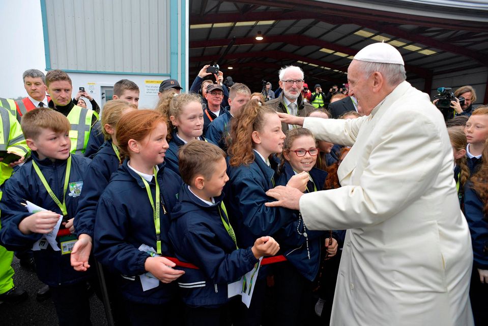 Pope Francis greets children after arriving in Knock, Ireland August 26, 2018. Vatican Media/Handout