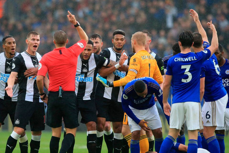 RED MIST: Newcastle United’s Isaac Hayden (l) is sent off by referee Craig Pawson for a challenge on Leicester City’s Dennis Praet during their Premier League at the King Power Stadium. Photo: LINDSEY PARNABY/AFP/Getty Images