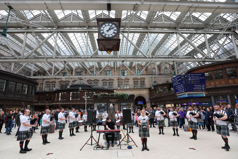 The ScottishPower Pipe Band performed a surprise set for passengers at Glasgow Central Station (ScottishPower/PA)