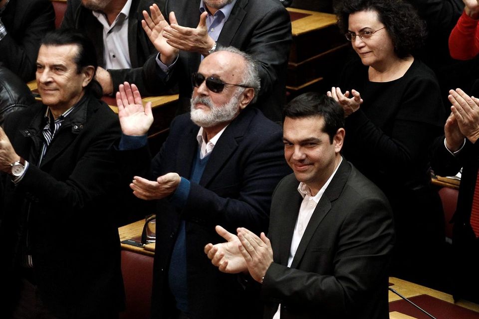 Alexis Tsipras (front row, on right), head of the radical leftist Syriza party, leads the applause after yesterday's presidential vote. REUTERS/Alkis Konstantinidis