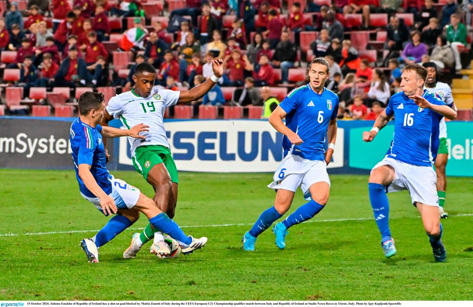 Aidomo Emakhu of Ireland has a shot on goal blocked by Mattia Zanotti of Italy