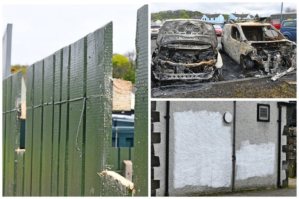 The scene in Bushmills, Co Antrim, where a man was nailed to a fence near two cars which were burnt out in a savage overnight attack