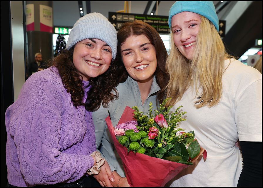 Katie O'Connor is welcomed home from Sydney Australia by sisters Rachel and Aine all from Faranfore Co Kerry  at Dublin Airport Arrivals.
Photo by Steve Humphreys