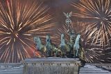 thumbnail: Fireworks light the sky above the Quadriga on the Brandenburg Gate in Berlin, Germany (AP)