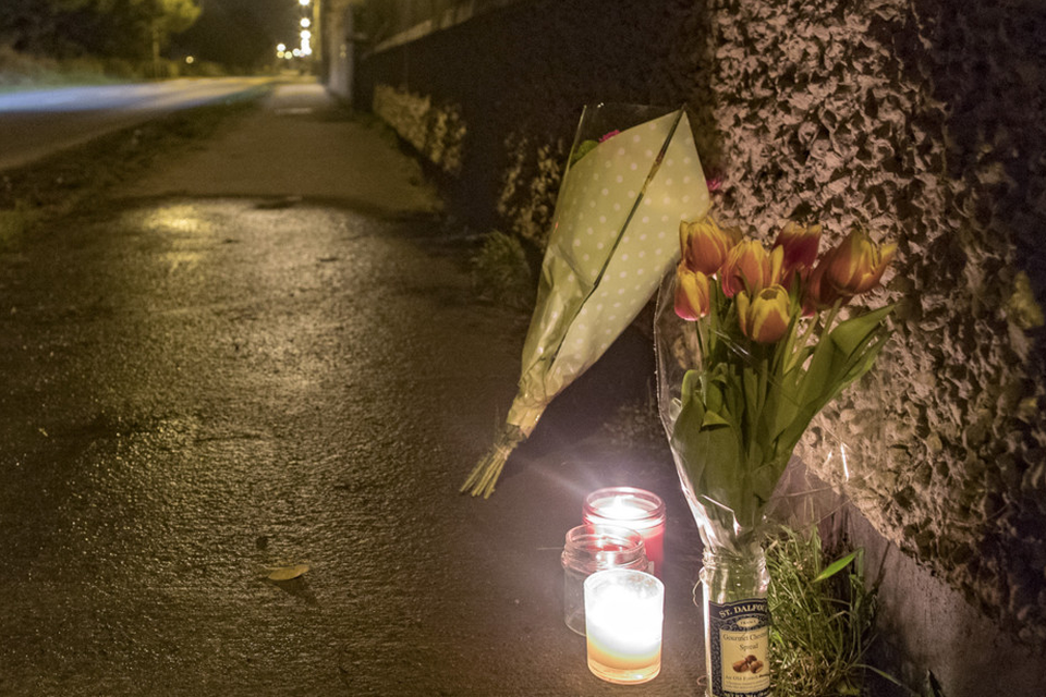 Flowers and candles left at the scene