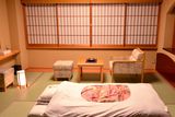 thumbnail: A futon is laid out for the evening at a ryokan, or traditional Japanese Inn. Omotenashi no Yado Keizankaku, outside Kyoto.