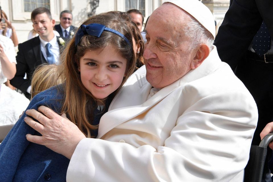Pope Francis blesses a young child during his weekly audience in the Vatican yesterday. Photo: Reuters