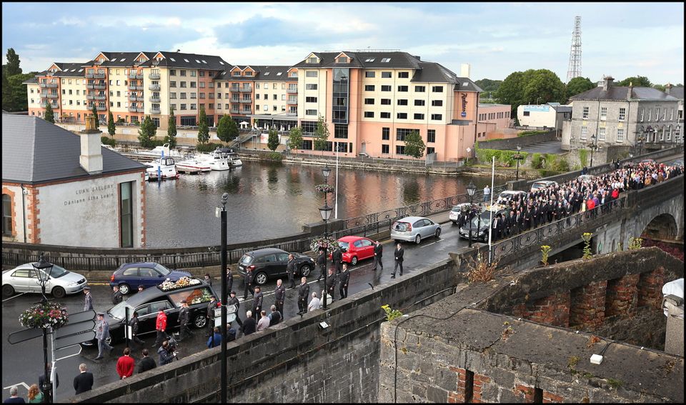 The remains of Larry and Martina Hayes tragically killed in Tunisia cross the Shannon to arrive at the Church of St Peter and Paul where the funeral mass will take.
Pic Steve Humphreys
2nd July 2015.