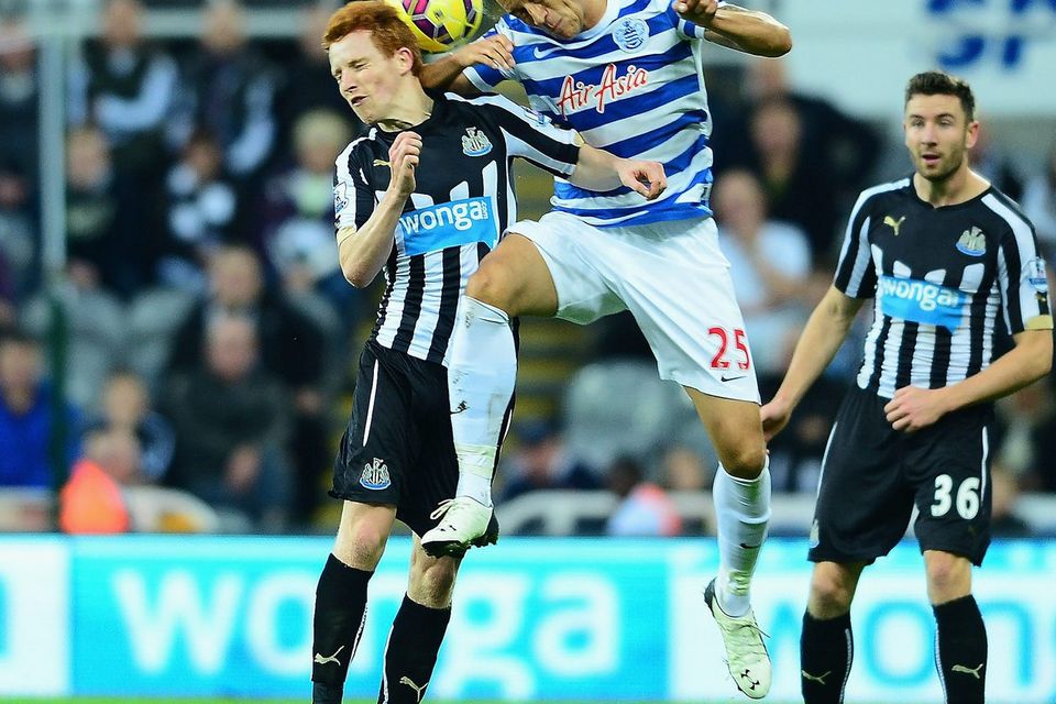 Newcastle's Jack Colback and Bobby Zamora compete for the ball. Photo credit: Mark Runnacles/Getty Images