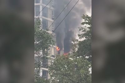 Seventy firefighters tackle blaze at east London tower block as three men treated at scene