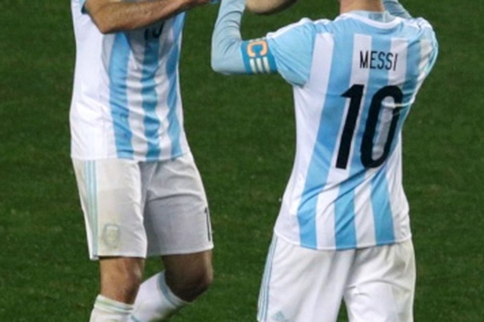 Argentina's Lionel Messi (10) and Martin Demichelis celebrate their victory over Paraguay in their Copa America 2015 semi-final soccer match at Estadio Municipal Alcaldesa Ester Roa Rebolledo in Concepcion, Chile, June 30, 2015. REUTERS/Jorge Adorno