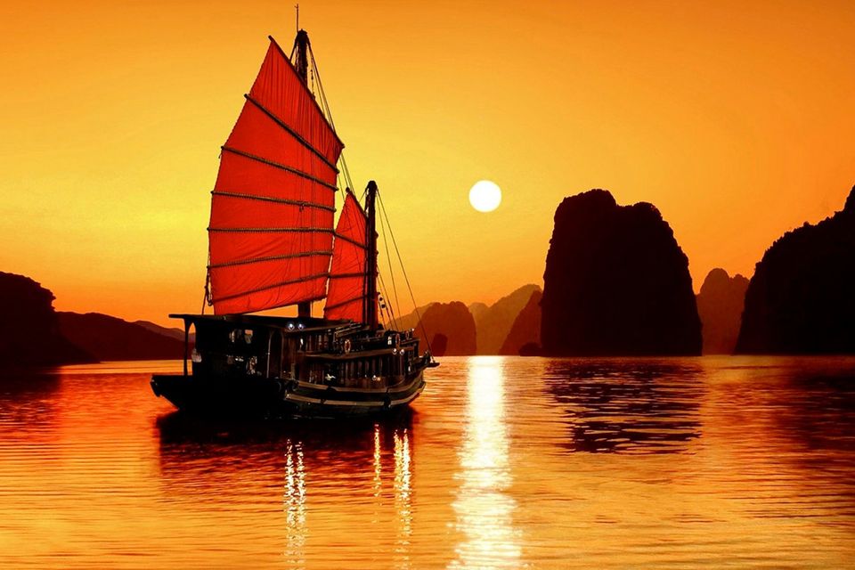 In Halong Bay you will sail among hundreds of oddly-shaped outcrops which jut out from the still blue waters - and time will stand still