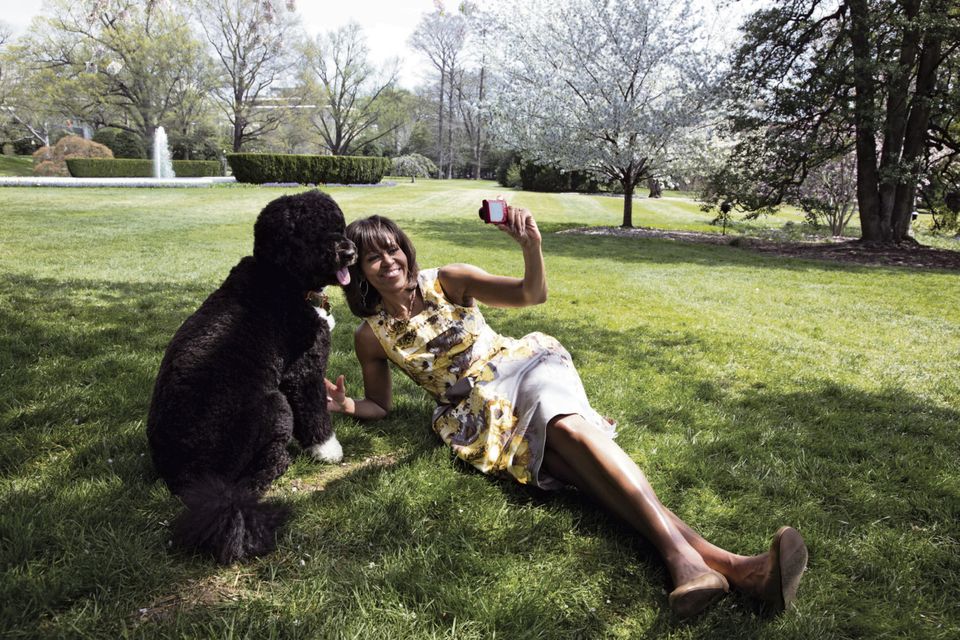 Kicking back: Michelle Obama on the White House lawn with Bo, the president's dog. Official White House Photo by Chuck Kennedy