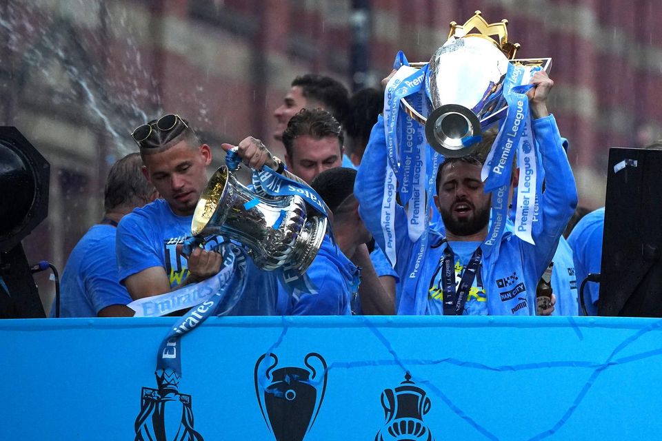 Manchester City’s Bernardo Silva lifts the Premier League trophy during the parade (Peter Byrne/PA)
