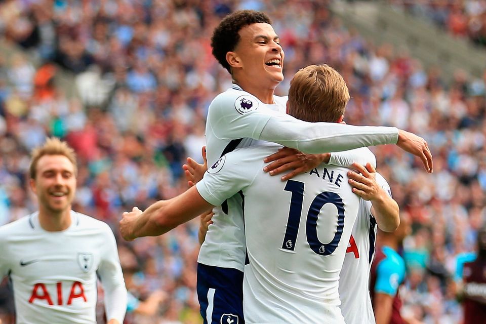 Harry Kane celebrates scoring his side’s first goal with team-mate Dele Alli. Photo: Getty