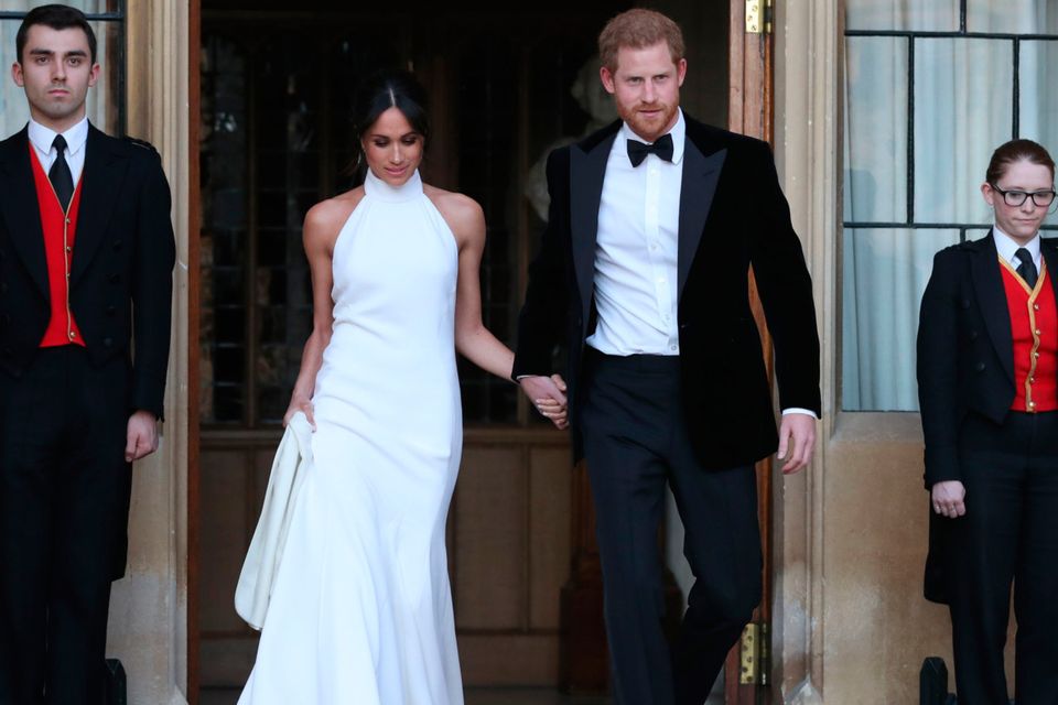 Mr & Mrs: the new Duchess of Sussex Meghan Markle sports a bespoke Stella McCartney halter-neck gown at the after party of her wedding to Prince Harry. Photo: AFP/Getty Images