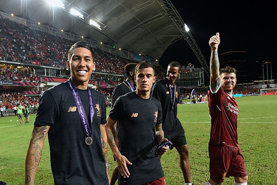 Roberto Firmino, Philippe Coutinho and Alberto Moreno of Liverpool at the end of the Premier League Asia Trophy match between Liverpool FC and Leicester City FC at the Hong Kong Stadium on July 22, 2017 in Hong Kong, Hong Kong.  (Photo by John Powell/Liverpool FC via Getty Images)