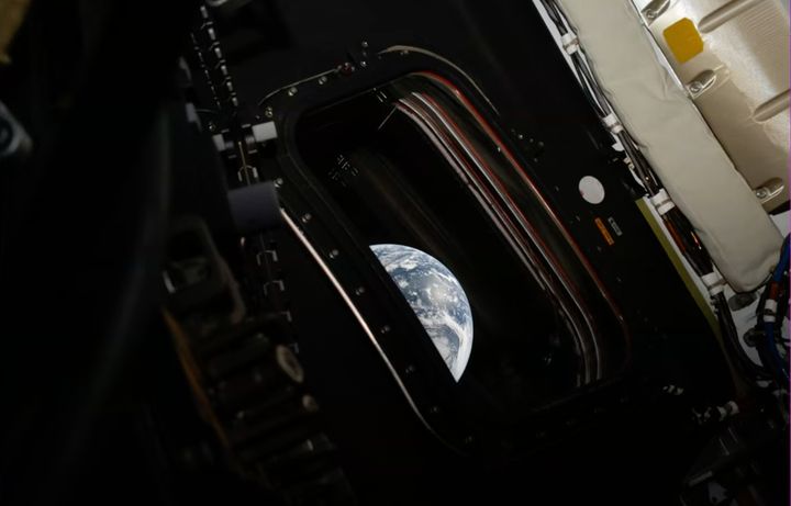 Nasa spacecraft halfway to the Moon as crew send back first images of earth