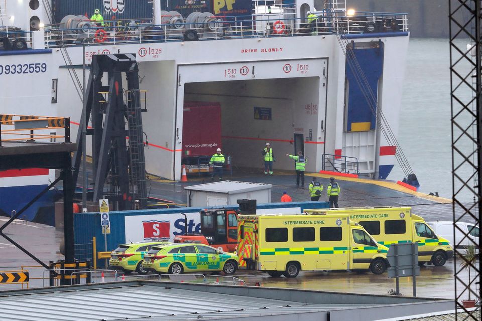 First aid: Emergency personnel at Rosslare Europort board the Stena Line ferry after 16 people were discovered in a sealed trailer. Photo: Niall Carson/PA Wire