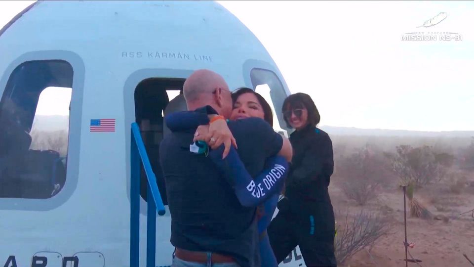 Lauren Sanchez hugging her partner Jeff Bezos after her flight in Blue Origin's spaceship. Photo: PA