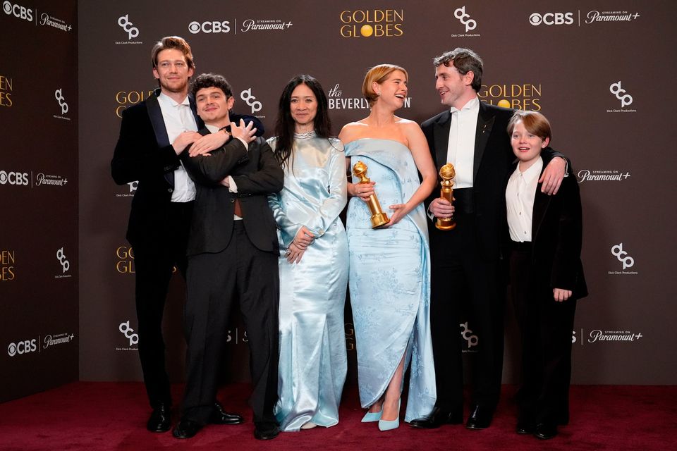 Joe Alwyn, from left, Noah Jupe, Chloe Zhao, Jessie Buckley, Paul Mescal, and Jacobi Jupe pose in the press room with the award for best motion picture - drama for "Hamnet" during the 83rd Golden Globes on Sunday, Jan. 11, 2026, at the Beverly Hilton in Beverly Hills, Calif. (AP Photo/Chris Pizzello)
