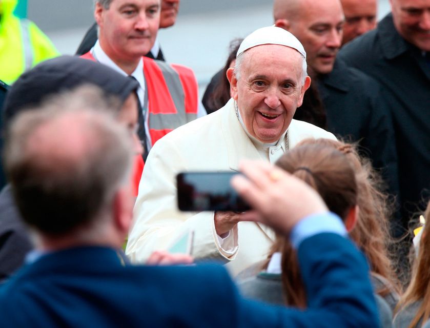 Pope Francis greets school children after arriving at the airport in Knock in County Mayo, as part of his visit to Ireland. 
Yui Mok/PA Wire