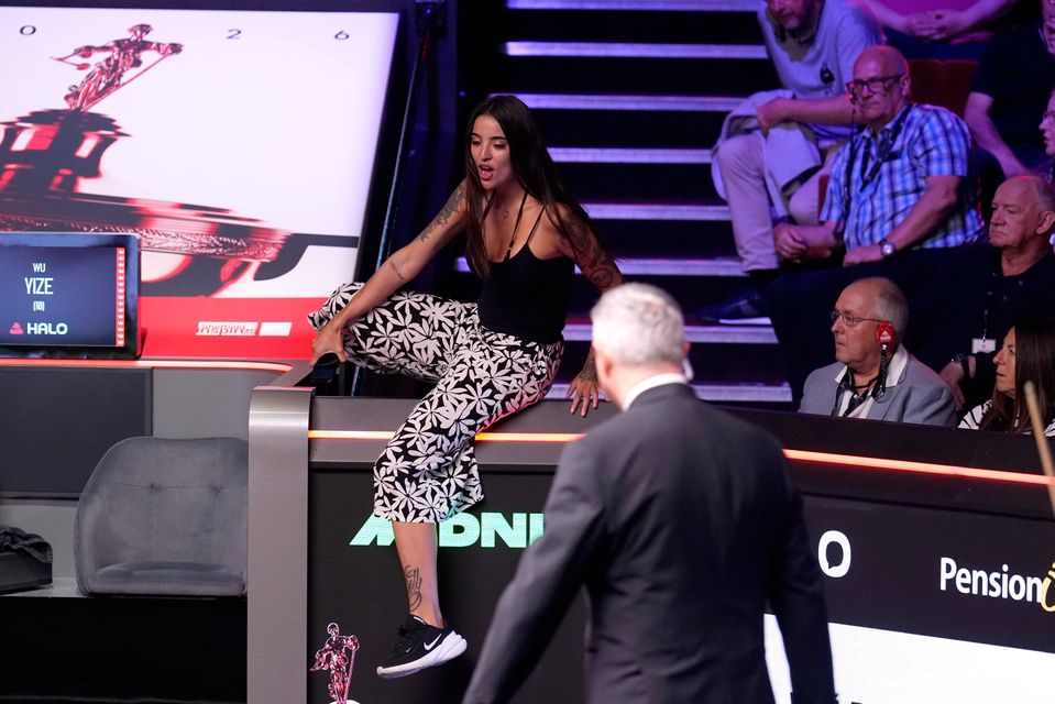 A protester disrupts and is subsequently stopped by the referee during Wu Yize's and Shaun Murphy's final at the Crucible Theatre, Sheffield. Picture date: Sunday May 3, 2026. PA Photo. (Mike Egerton/PA Wire)