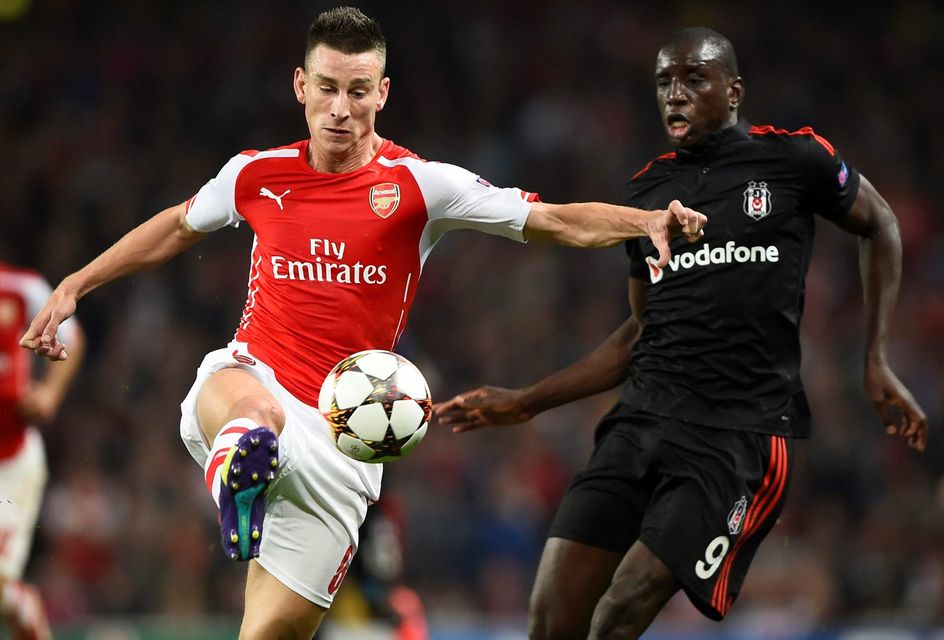 Arsenal's Laurent Koscielny and Besiktas striker Demba Ba battle for possession during the Champions League qualifier at the Emirates. Photo: REUTERS/Dylan Martinez