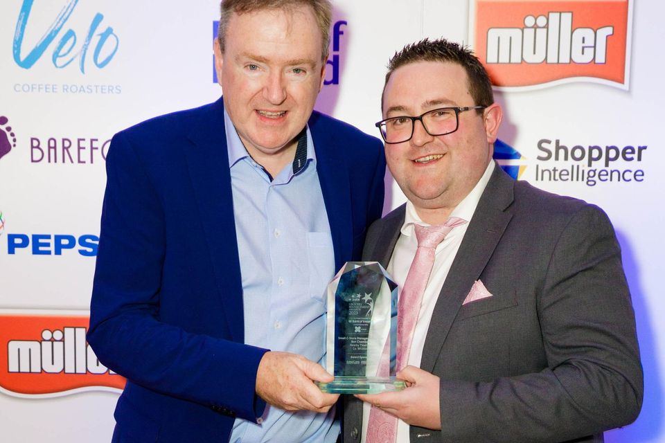 Eamonn O'Toole, executive director, Salescare, presents the Small C-store Manager of the Year Award sponsored by Salescare/Promate to Darren Meaney on behalf of the winner, Ben Chambers, Nearby Tinahely at the ShelfLife Grocery Management Awards 2023. Photo: Joe Keogh
