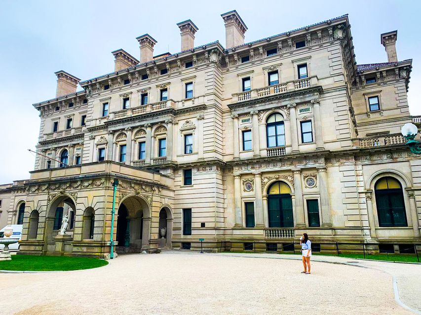 Caitlin McBride at the Breakers mansion in Newport, Rhode Island (for scale)