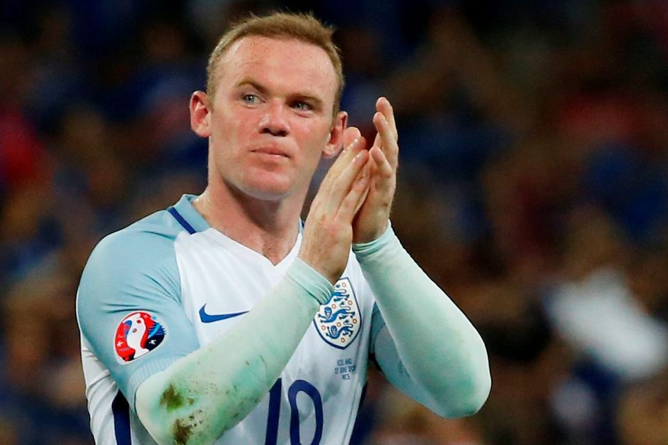 Wayne Rooney applauds the England fans at the end of the game
