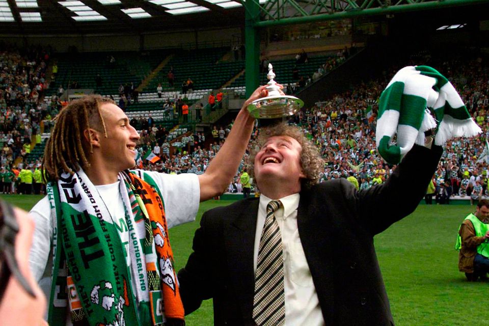 Celtic striker Henrik Larsson celebrates with his manager Wim Jansen after winning the League Cup against St Johnstone