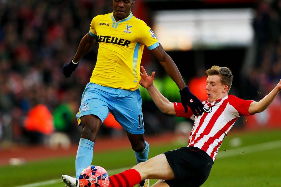 Wilfried Zaha of Crystal Palace is challenged by Matt Targett of Southampton during the FA Cup Fourth Round match between Southampton and Crystal Palace at St Mary's Stadium