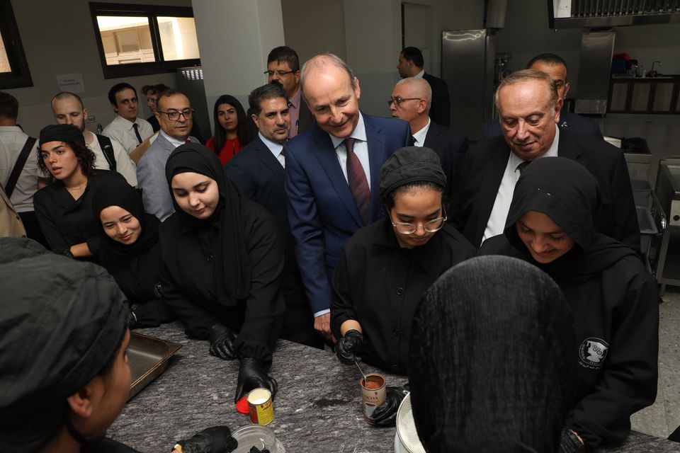 Tánaiste Micheál Martin with Palestinian education minister Mahmoud Abu Mowais (on right) and students at a school in the West Bank. Photos: David Conachy