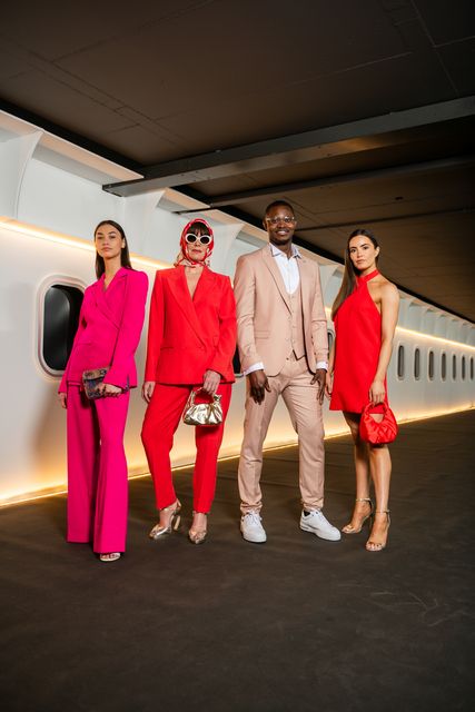 Models at the Victoria Square 'In Flight' catwalk show wearing a fuchsia suit from Rio Brazil, red suit from Mango, cream suit from Remus Uomo and red dress from Mango. Photo: Collette O'Neill. 