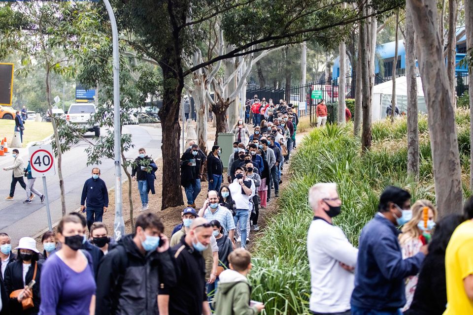 Long queues of people at the NSW vaccination centre today in Sydney, Australia. Photo: Jenny Evans/Getty Images