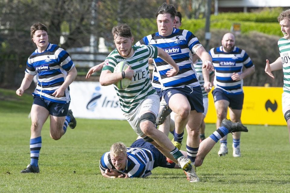 Conor McAleer escapes the clutches of the Corinthians defence.