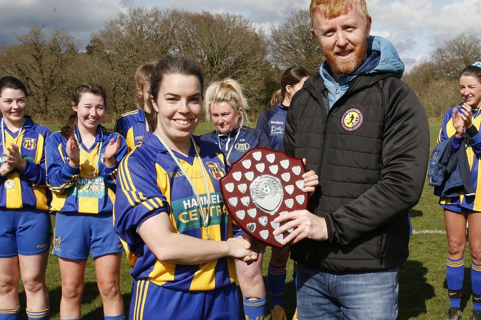 Sophie Donnelly receiving the shield from Barry Dempsey.