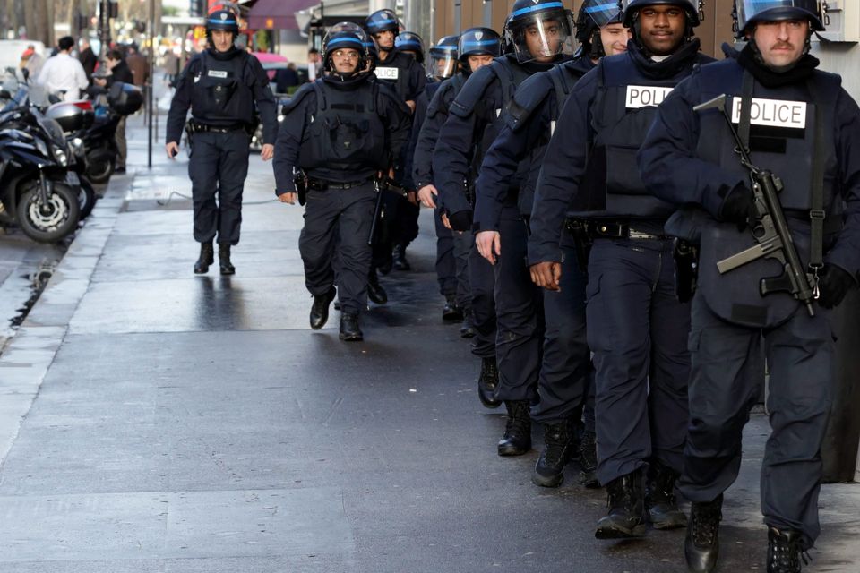 French riot police patrol in central Paris as part of the highest level of "Vigipirate" security plan after a shooting at the Paris offices of Charlie Hebdo January 9, 2015