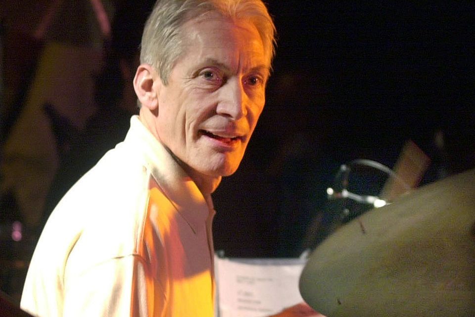 FILE PHOTO: British Rolling Stones pop star Charlie Watts performs on drums during her concert in Barcelona late November 24, 2001. REUTERS/ Gustau Nacarino/File Photo