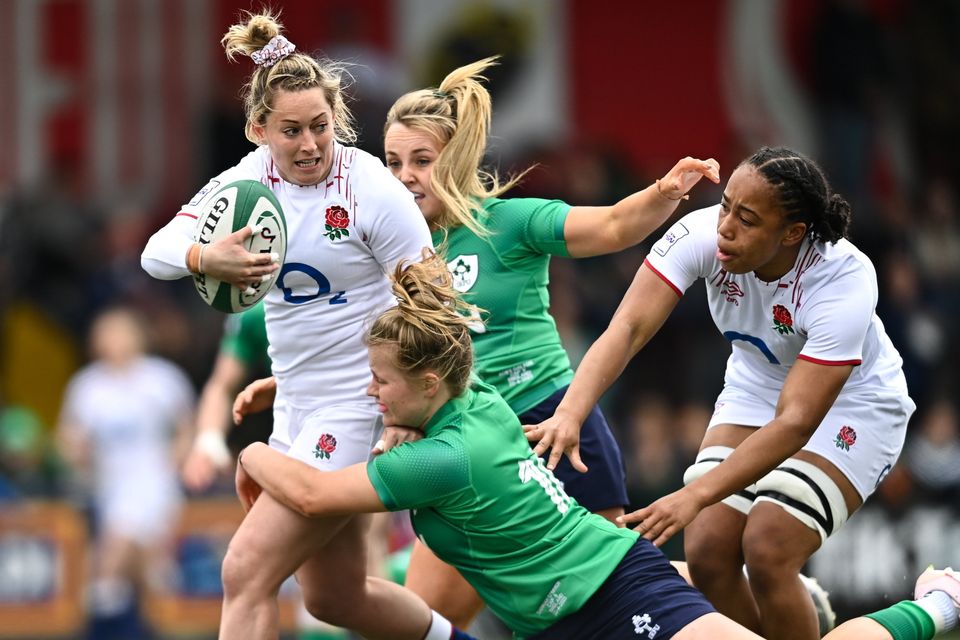 Natasha Hunt of England is tackled by Dannah O'Brien. Photo by Eóin Noonan/Sportsfile