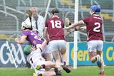 thumbnail: Rhys Wickham is taken down by Seán Kelly for Wexford's late penalty. Photo: Jim Campbell