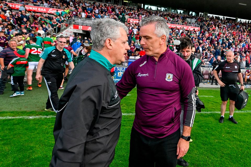Galway manager Padraic Joyce, right, and Mayo manager Kevin McStay
