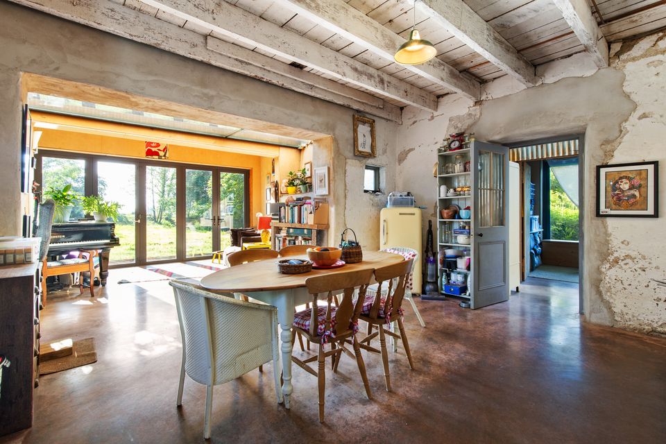 An open-plan space with dining table