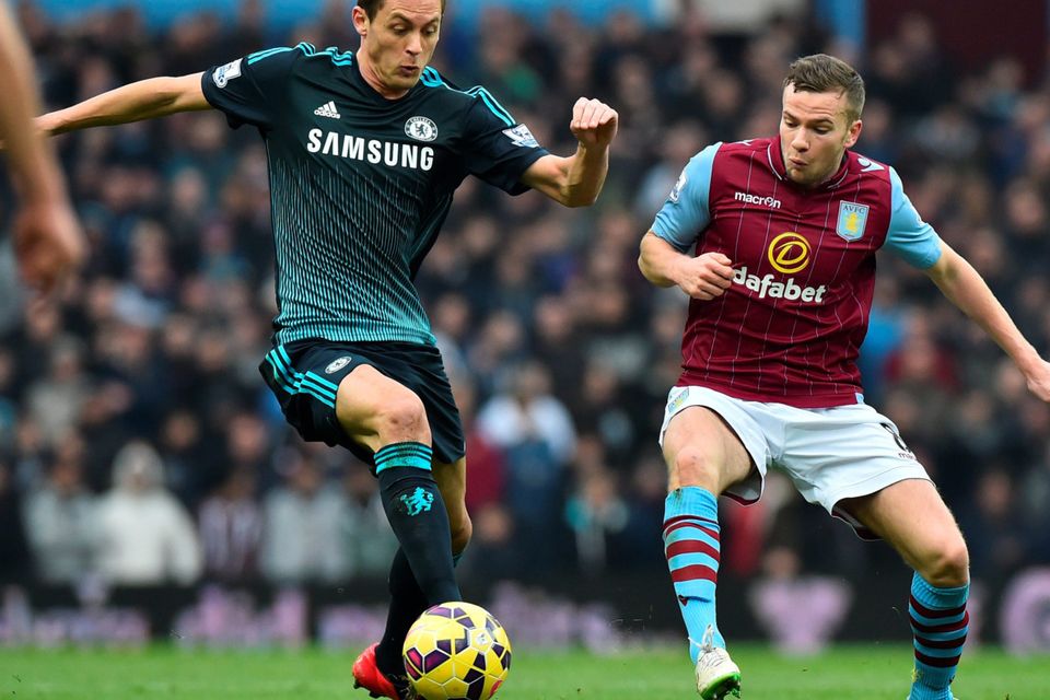 Chelsea's Serbian midfielder Nemanja Matic (L) vies with Aston Villa's English midfielder Tom Cleverley
